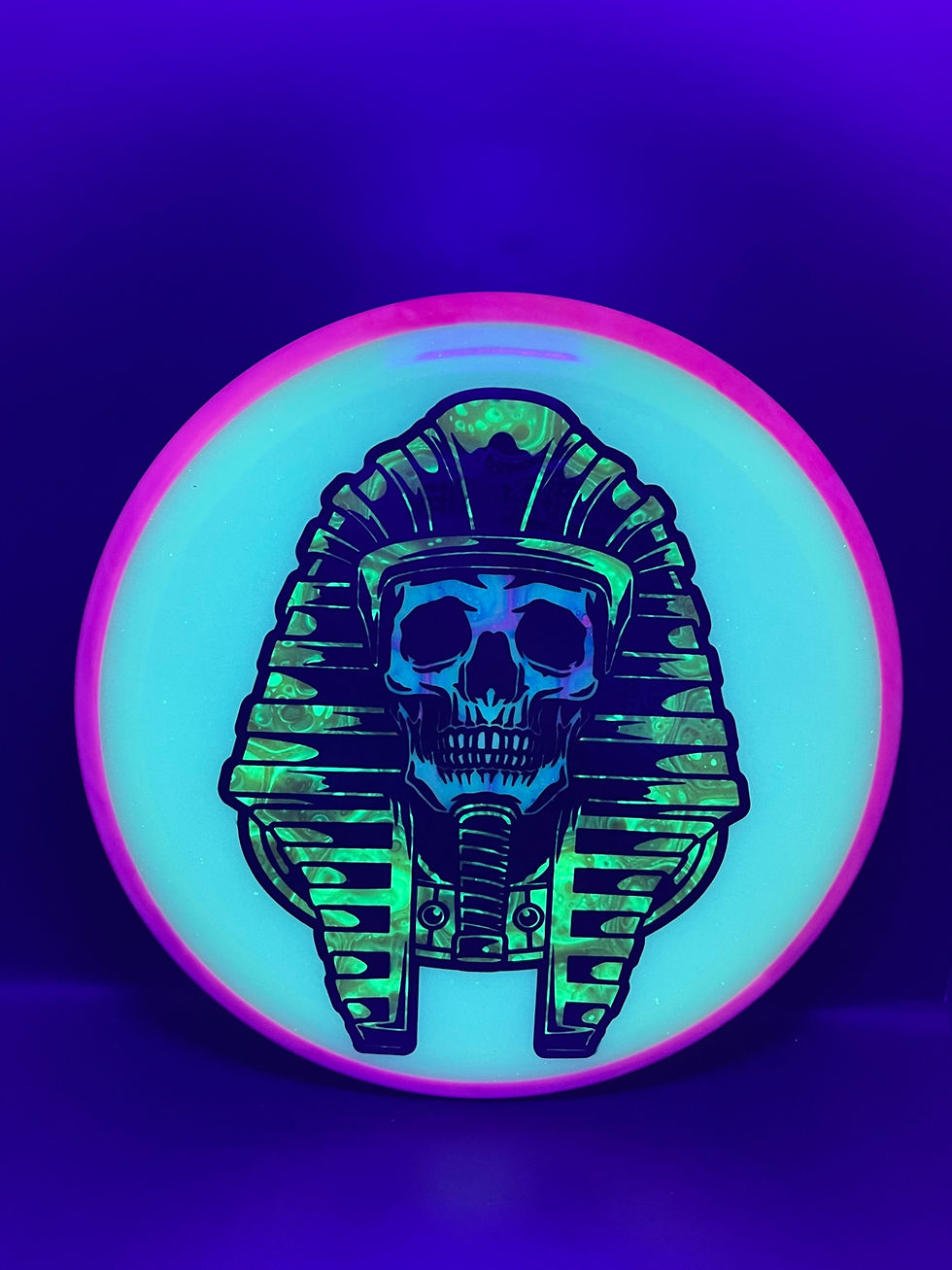 Frontside Blue and Gold Pharaoh Glow Crave under blacklight