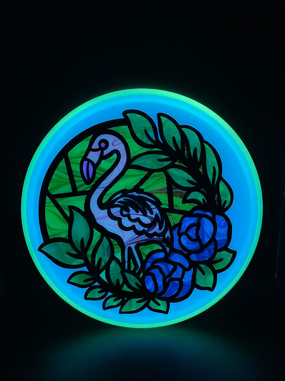 Thumbnail: Frontside Stained Glass Flamingo Glow Envy glowing after blacklight charge
