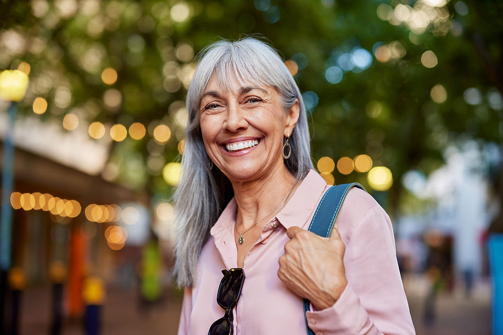 smiling-silver-haired-woman-outdoors-in-urban-sett-2026-03-25-03-32-18-utc.jpg