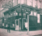 White Horse Tavern, New York City. Exterior view, with African American man walking by. Note two-light traffic signal. / World Telegram & Sun photo by Phyllis Twachtman.