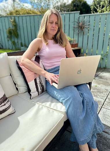 Janie Rae working on a laptop