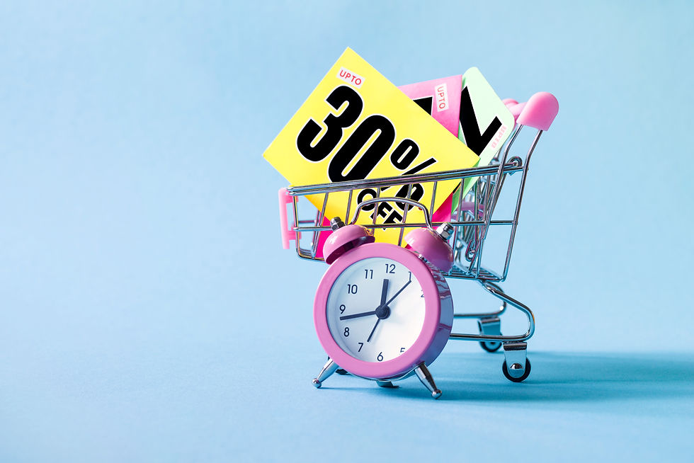 Mini shopping cart with a thirty percent discount sign and pink alarm clock on blue backgr