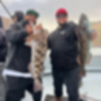 Anglers holding a catch during Berkeley Lingcod & Rockfish fishing.