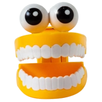 Jouet dentier jaune avec des grands yeux prêt à poser des questions absurdes