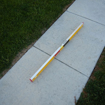 Level on flat sidewalk surface.
