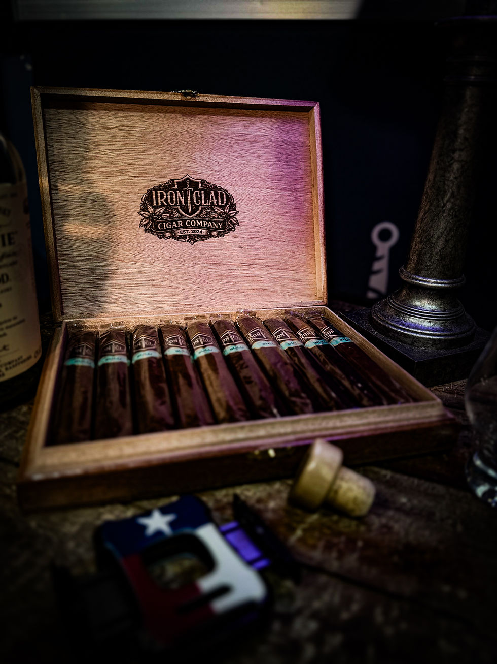 Open wooden box of premium boutique cigars