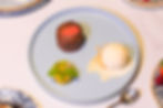 A plate of Lava cake,gelato and fruit salad