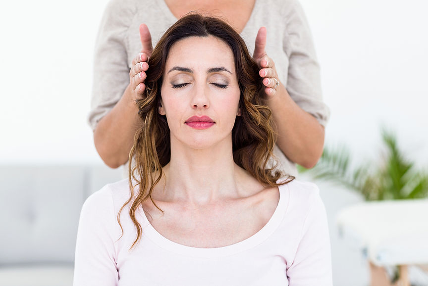 bigstock-Calm-woman-receiving-reiki-tre-
