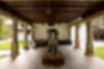 The colonnaded transition space of Paliam Palace is welcomed by an elephant statue.