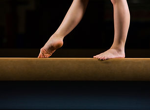 Female Gymnast on Balance Beam