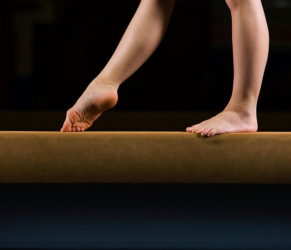 Female Gymnast on Balance Beam