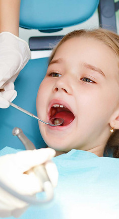 niño-con-dentistas.jpg