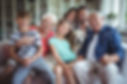 portrait-happy-family-sitting-sofa-livin