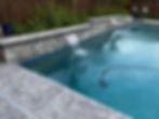 Custom pool design: stone wall with two waterfalls