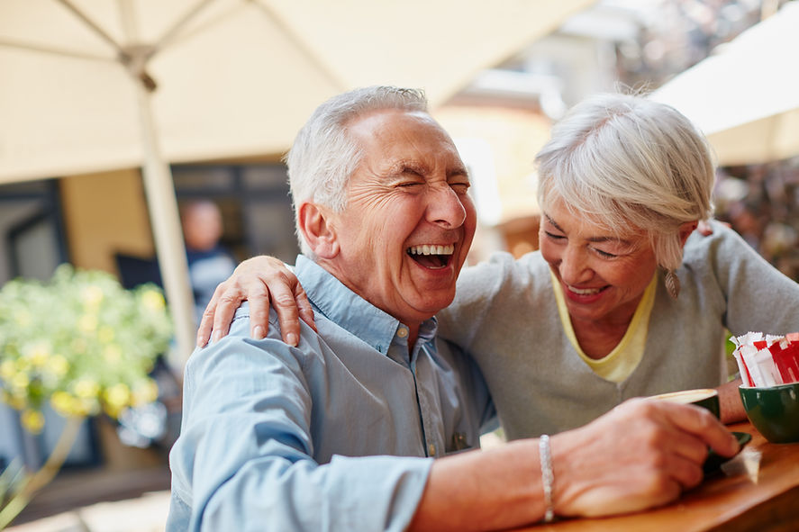 senior-couple-drinking-coffee-laughing.jpg