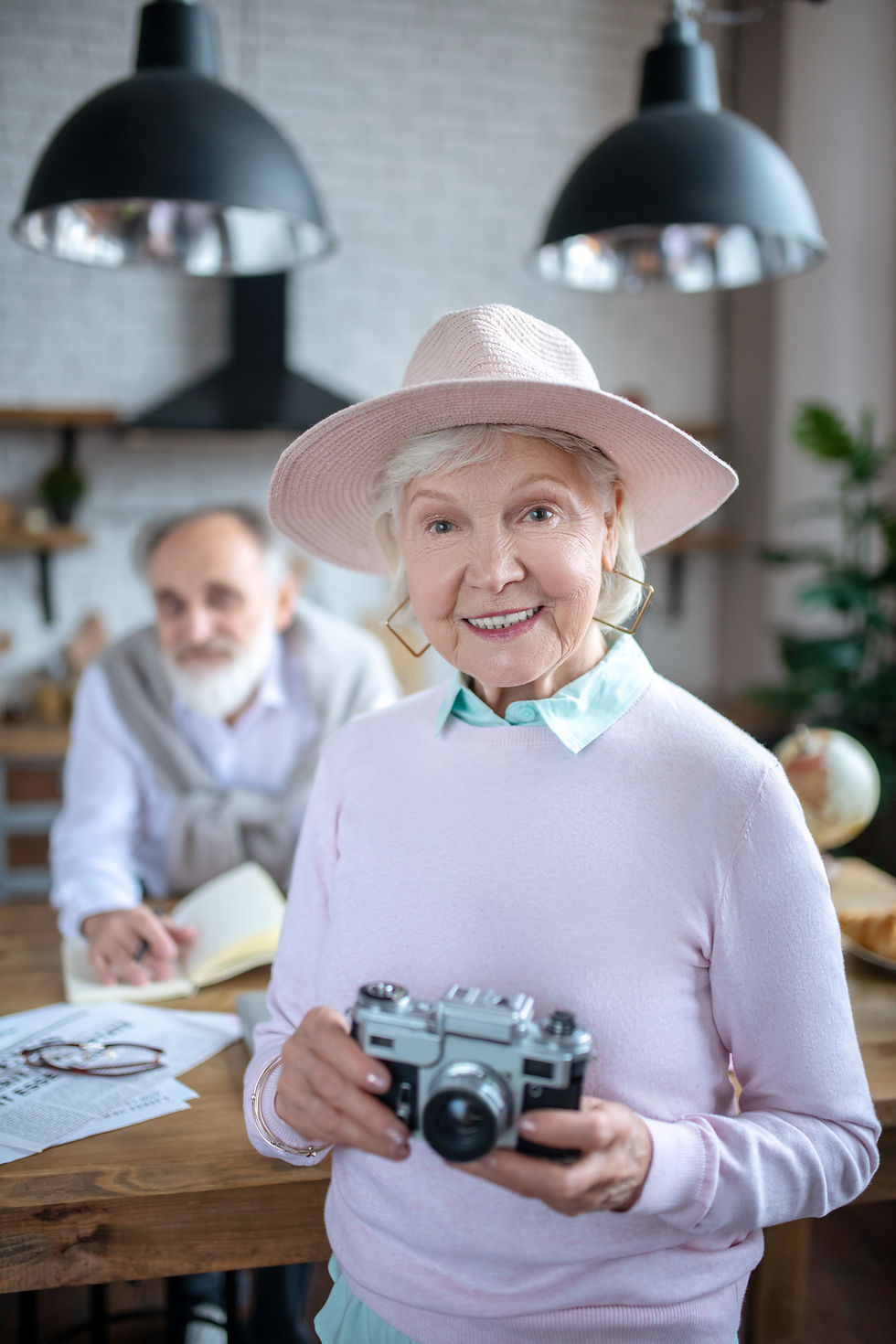 Senior Woman engaging in photography at Omega Senior Living Communities