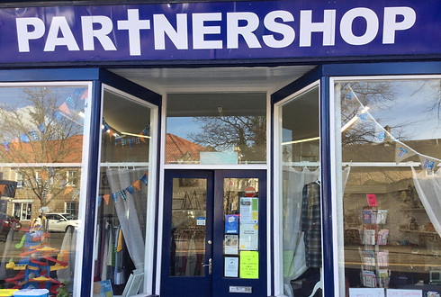 A picture of the shop front of the Partnershop, the churches charity shop