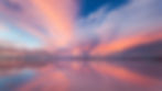Pink and blue sunset reflected in a salt flat