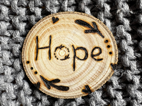 Wooden disc etch with pyrography word hope