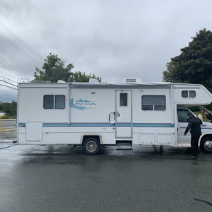 Men washing a motor home