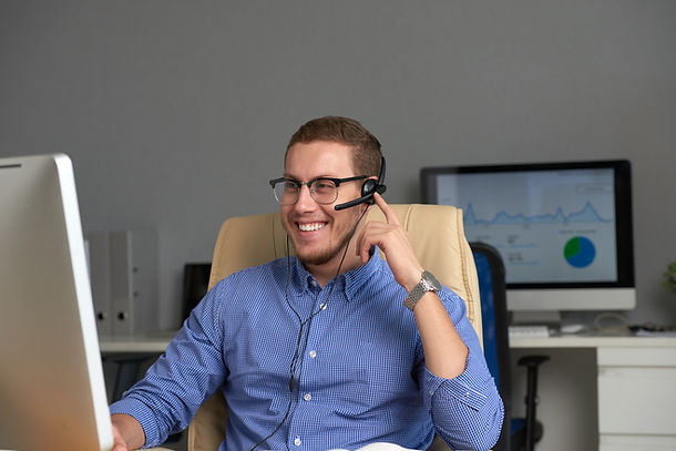 medium-shot-of-happy-manager-working-in-call-centre.jpg