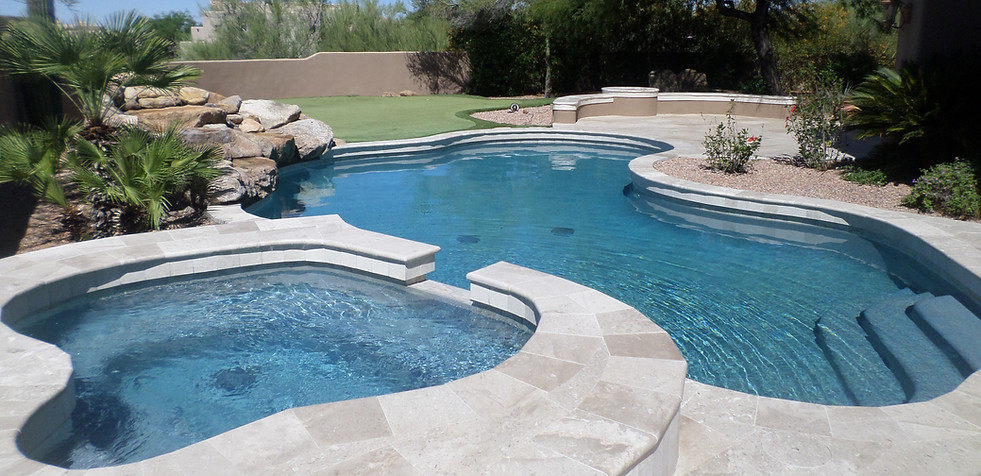 Swimming Pool Service & Repair Remodeled Pool Completed in Scottsdale with Raised Spa, Pool and Rock Feature.
