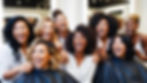 group of hairstylist of mixed race and diverse ethnicities laughing in high glam.jpg