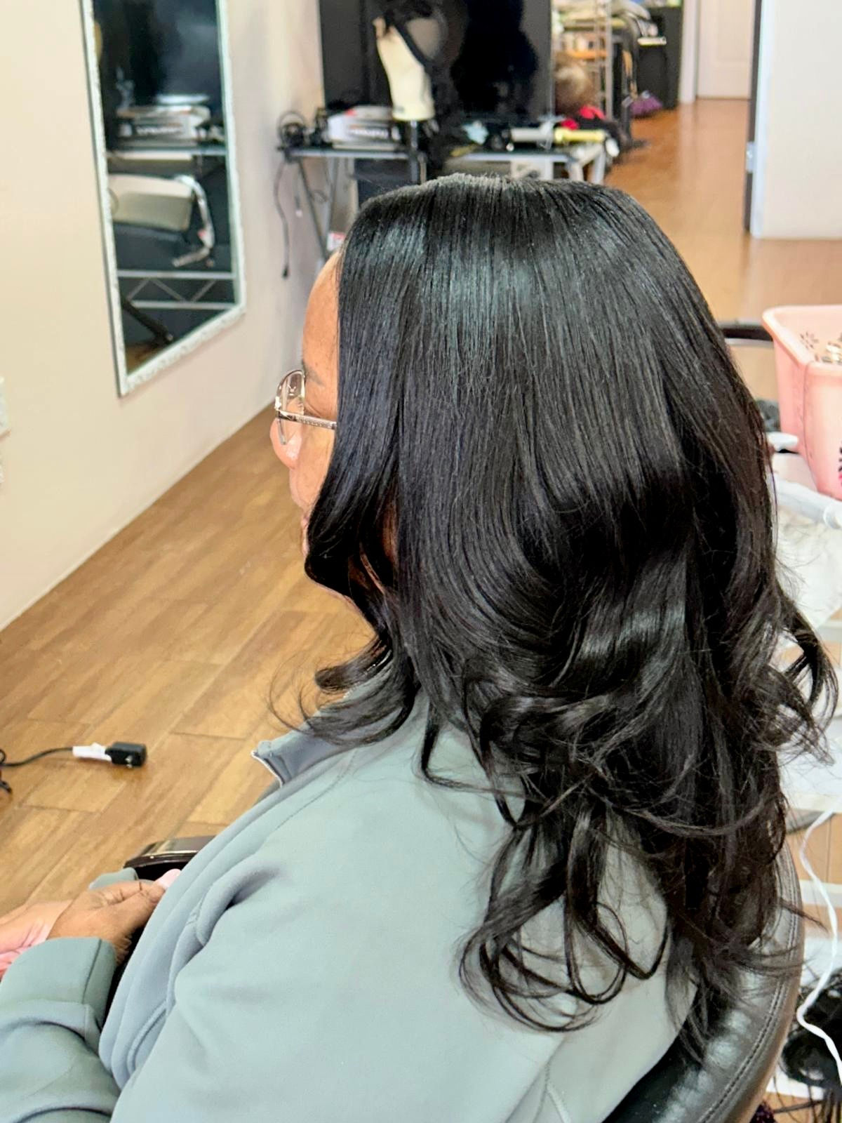 sew-in with leave-out hairstyle styled at Unique Braids and Weaves hair salon, Houston, Texas