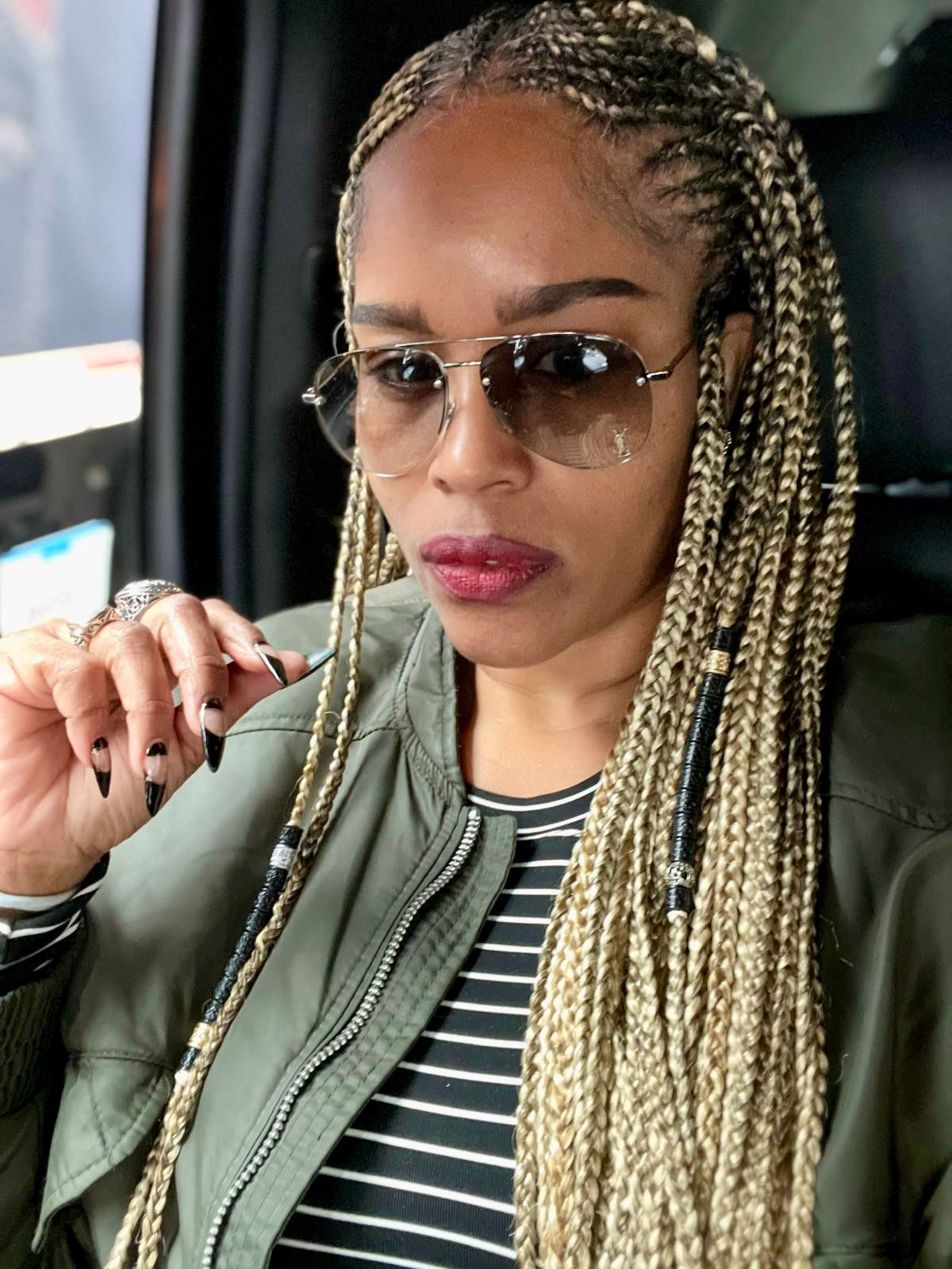 woman with Fulani braids hairstyle braided at Unique Braids and Weaves Hair Salon, Houston Texas