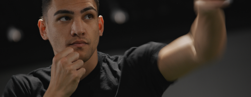 A boxer throws a punch