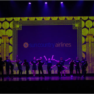 stage view of the showcase with Sun Country ad