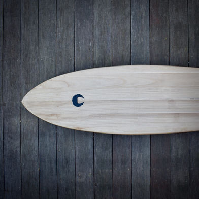 SINUM surfboards 6'5" KNIFE set-up surfboard with black resin panel on tail, perspective