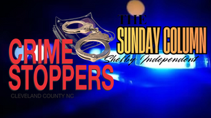 The Crime Stoppers logo and The Sunday Column logo with blue police lights int he background