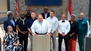 Chief of Police Brad Fraser speaks from the podium