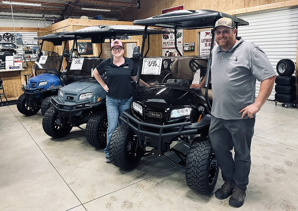 From left, Stephanie Allison and Casey Allison, in their showroom, have built a career on selling quality golf carts and customer care.        Chuck Thompson | Shelby Independent