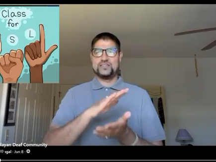 A Nepali man wearing glasses and a blue shirt is signing. In the upper left is a graphic that says Class for ASL. 