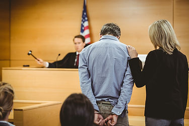 Man in court in handcuffs