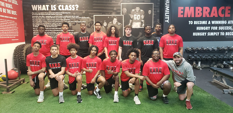 New Carroll head coach Steve Honick with his players training in the Dom D'Alicandro Memorial weight room. Photo by Al Thompson.