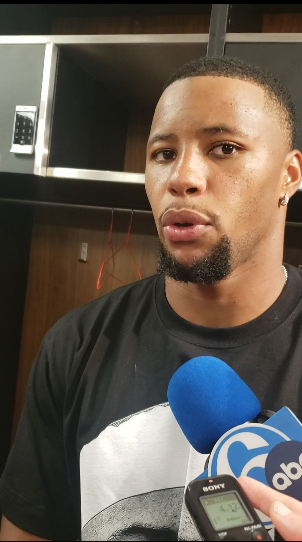 Eagles running back Saquon Barkley talks at his locker after rushing for 88 yards on 22 carries and a 13-yard touchdown. Photo by Al Thompson.