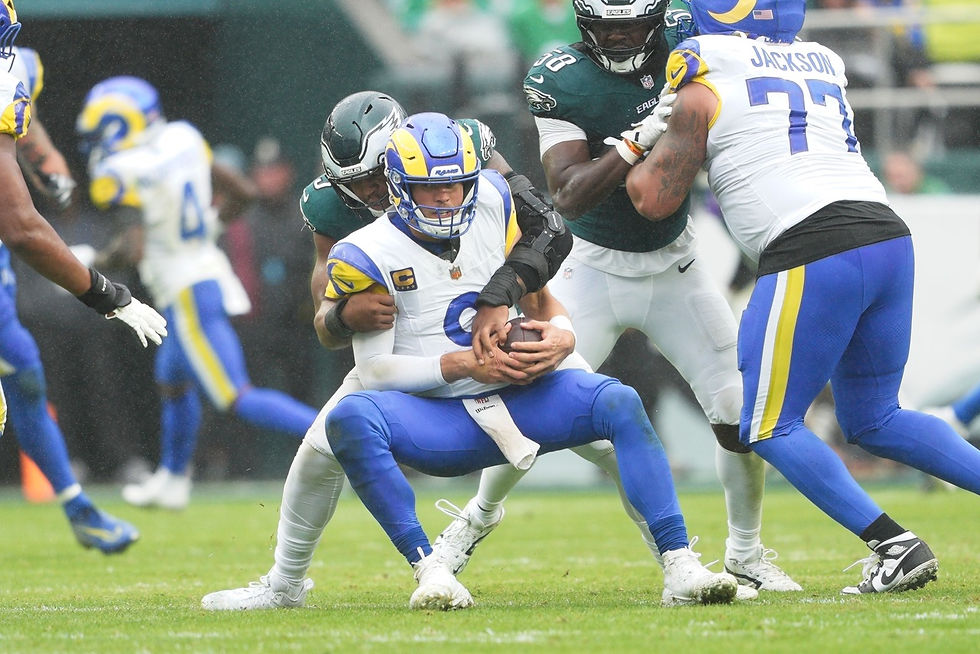 Nolan Smith sacks Rams QB1 Matthew Stafford. Photo by Andy Lewis