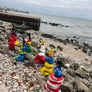 Fun painted rocks on the beach in Lisbon