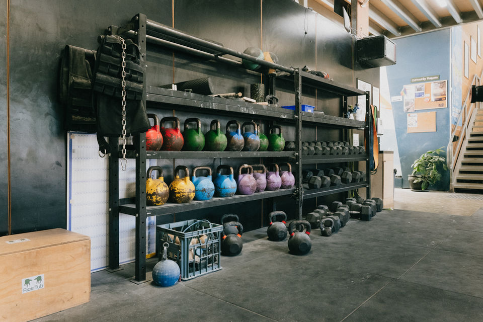 kettlebells and dumbbells on shelving