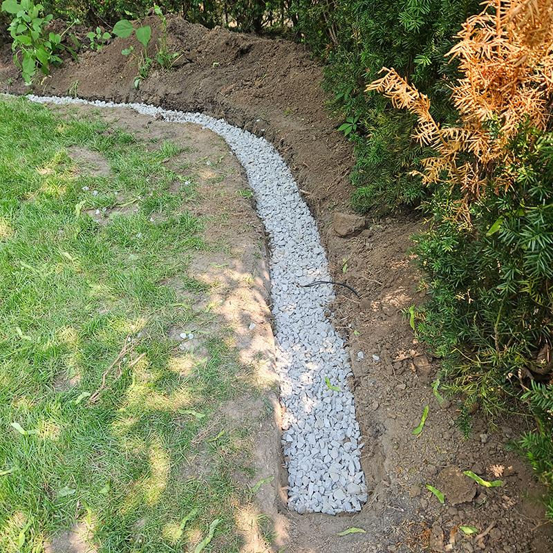French drain installation for residential drainage in Oakville Ontario