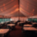 image inside a tent with tables and chairs like a movie.jpg
