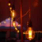 warm lightbulbs in a partytent with sunset.jpg