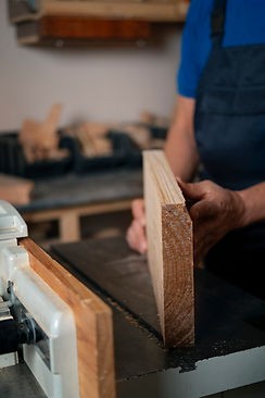 wood-worker-his-shop-working-with-tools-equipment.jpg