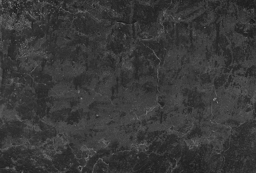 Dark gray textured background with visible cracks and imperfections on surface.