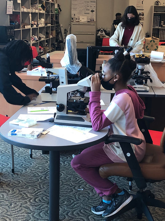 girl on microscope.jpg