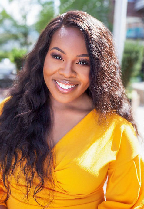 A professional outdoor headshot by A Brew and You of a Women wearing a Yellow Dress with Sunlight hitting her hair.