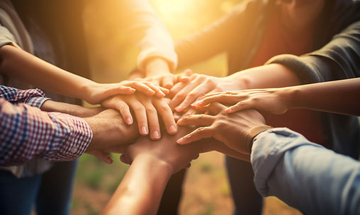 image of multiple hands connecting in a huddle